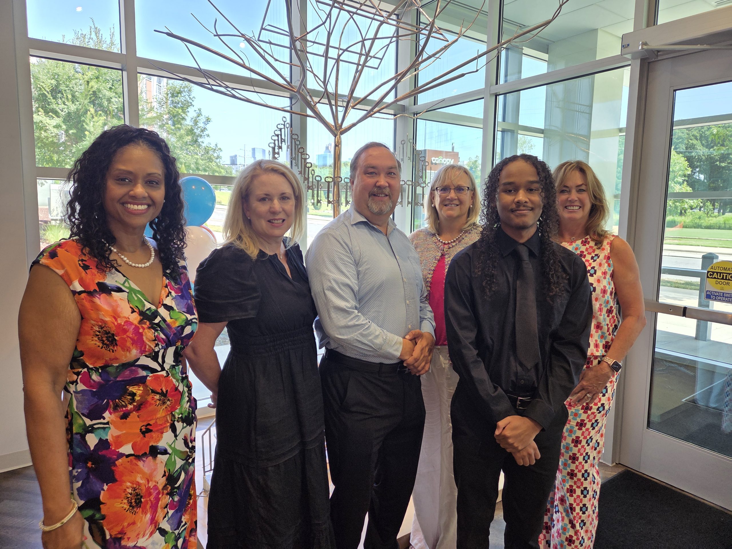 2025 YES Award winner Alexander Riley, with Canopy's Executive Team.