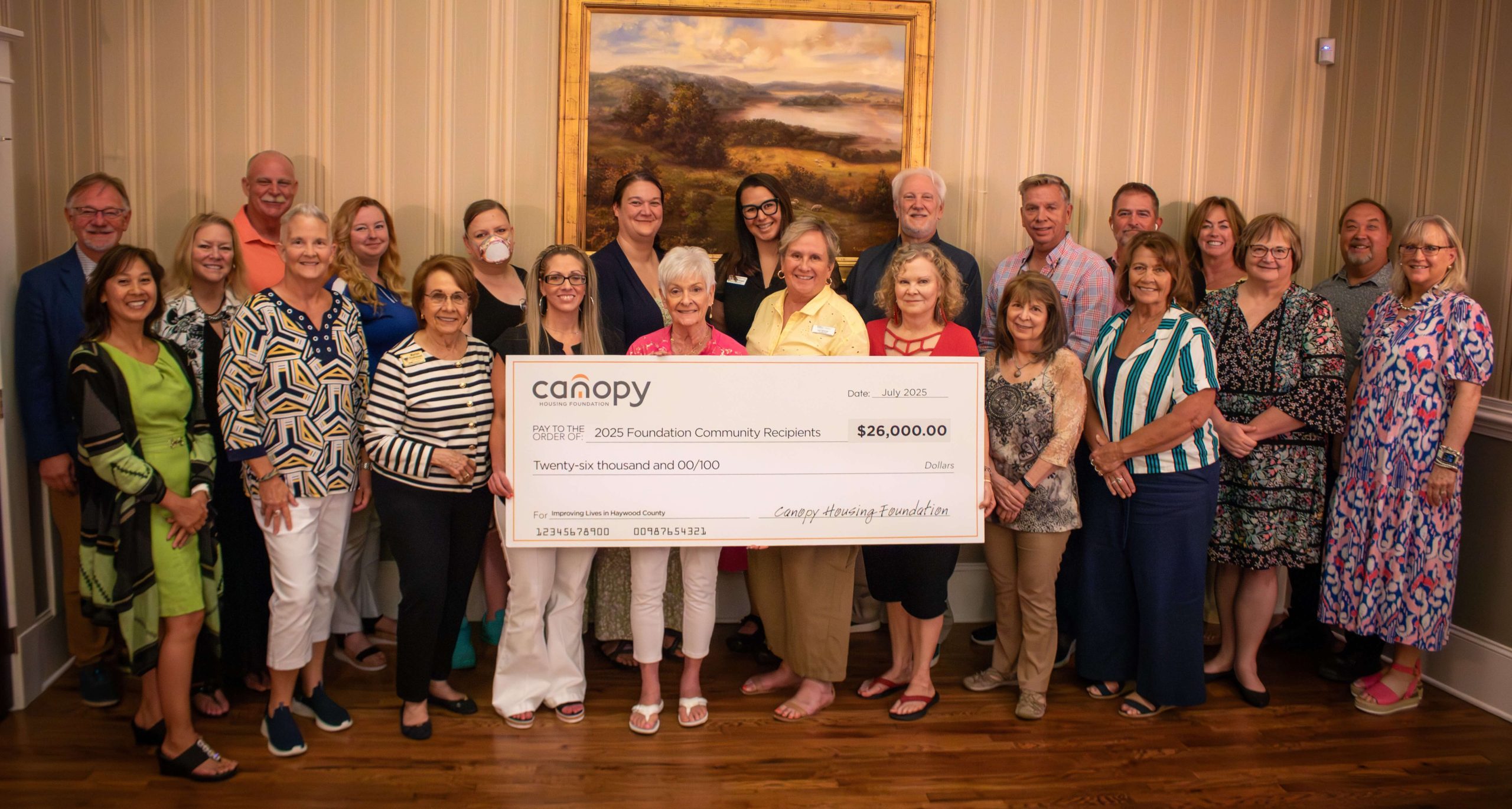 Western Region Community Grants Awarded at Celebration. Attendees hold "big check" in the amount of $26,000.